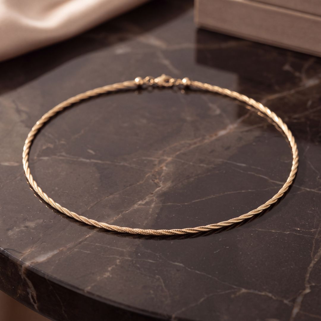 Striking twisted Omega necklace in 9ct Yellow Gold